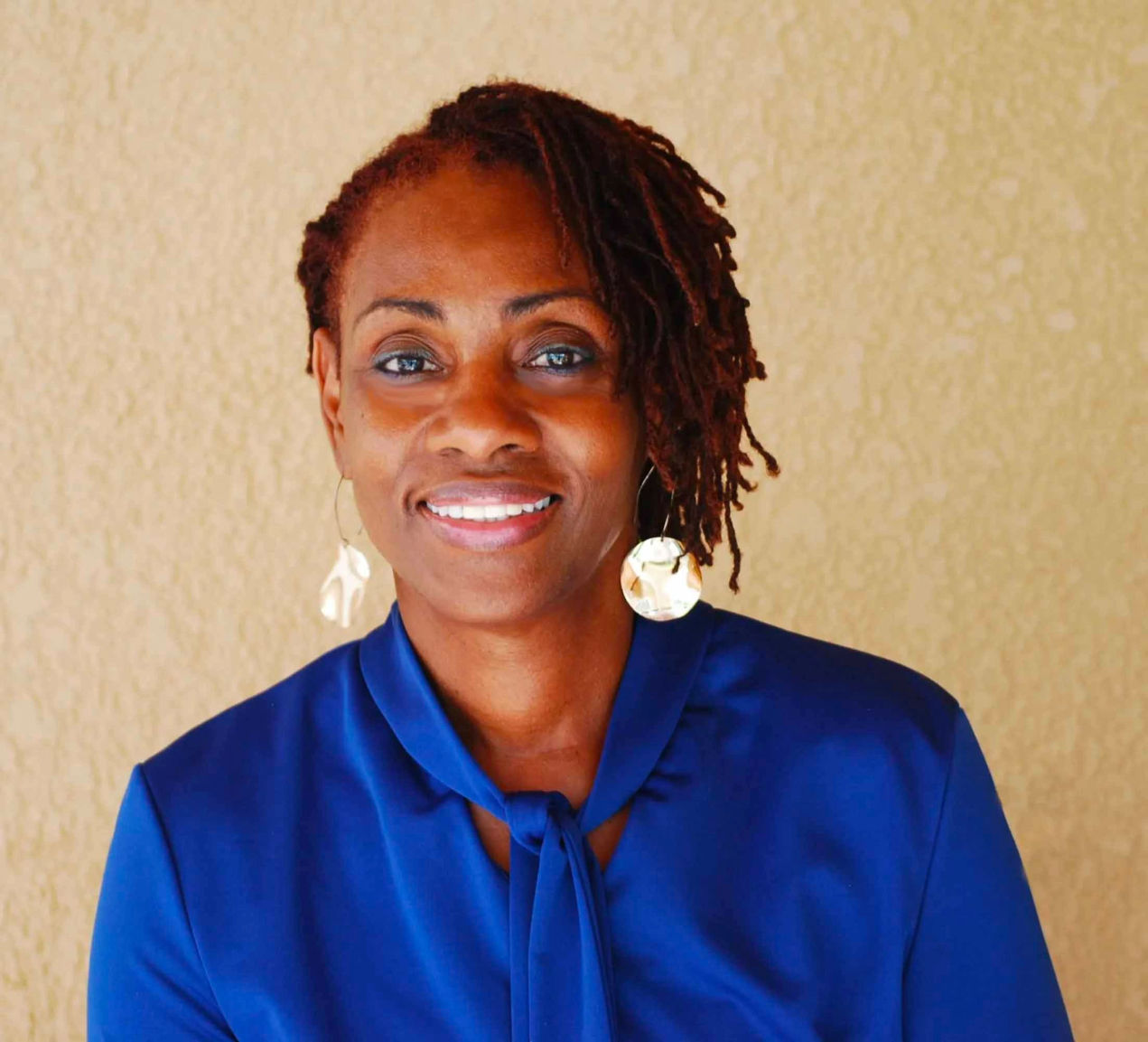 Denise E Hewitt- Licensed Trichologist and Master Cosmetologist with over 30 years of experience.